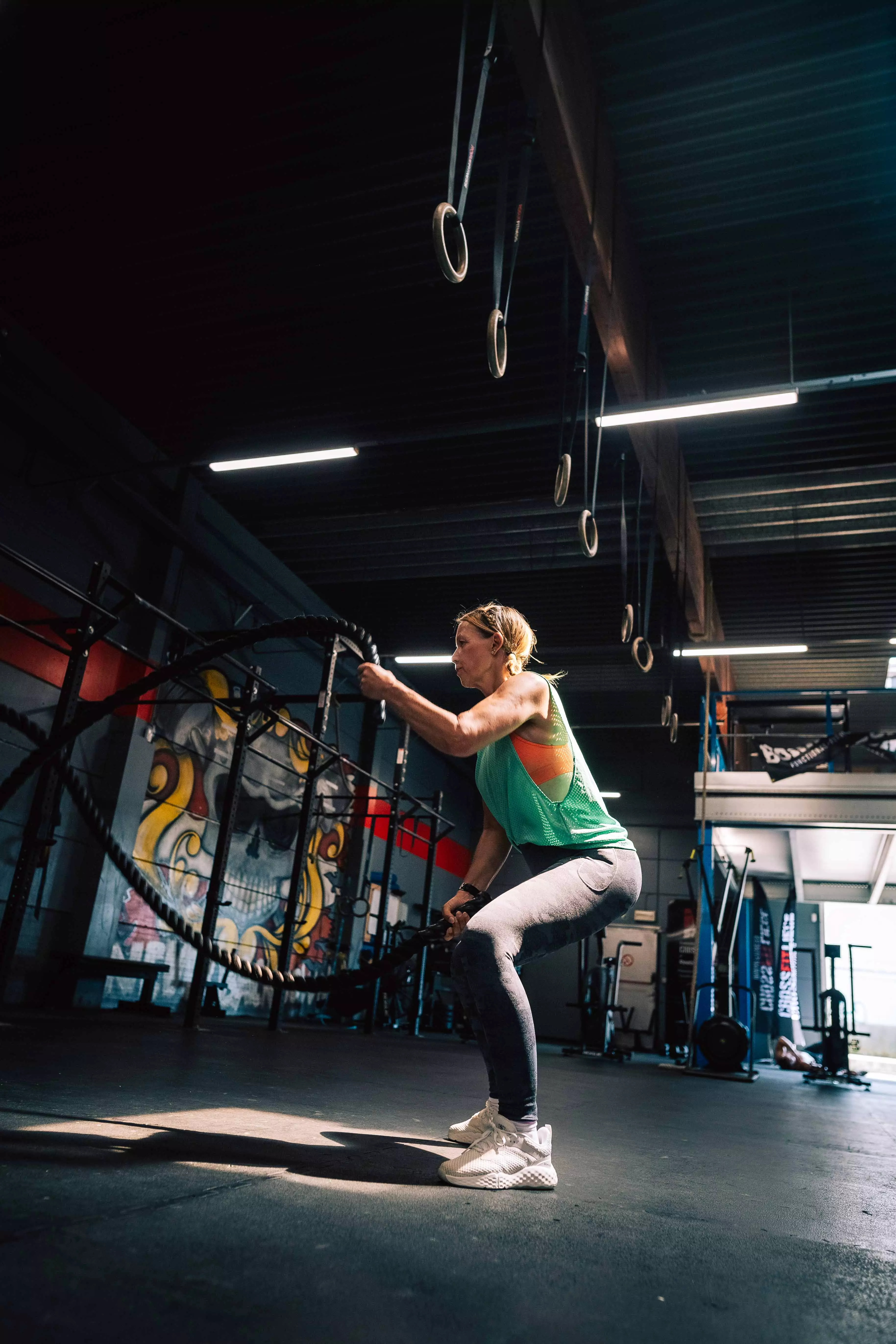 sport woman muscle crossfit rope